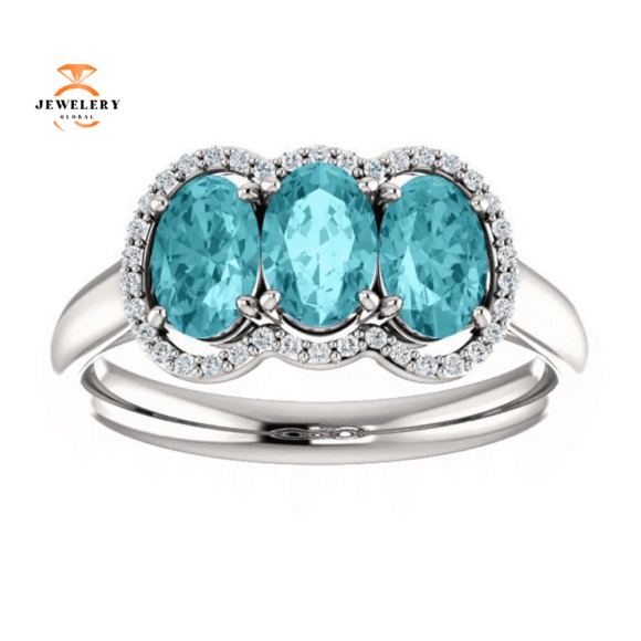 14KT GOLD 2.25 CTW BLUE ZIRCON & 0.10 CTW DIAMOND 3 STONE OVAL HALO RING - Image 3