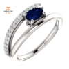 14KT GOLD BLUE SAPPHIRE & 1/8 CTW DIAMOND BYPASS RING