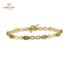 10KT YELLOW GOLD 4 CTW PERIDOT & .025 CTW DIAMOND BRACELET